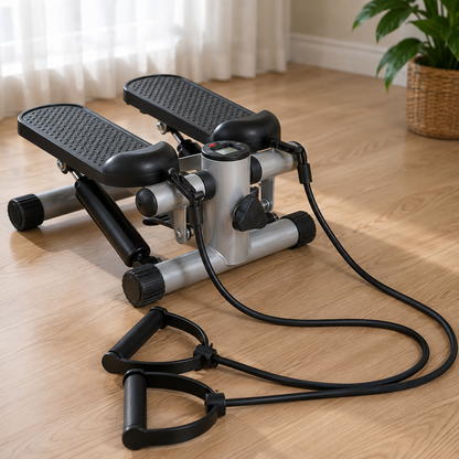 Original Mini Stepper shown with its two resistance bands and handles laid out on a hardwood floor