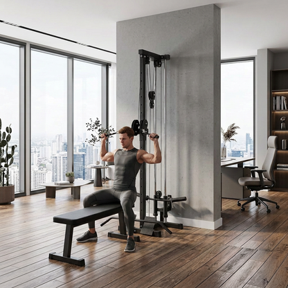 Muscular man using the wall-mounted cable machine from a workout bench in a home office, city skyline visible through floor-to-ceiling windows.